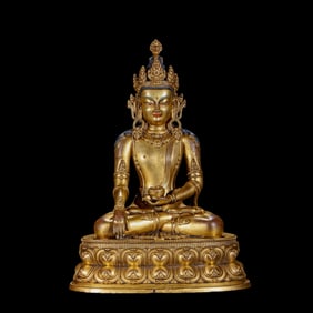 A Chinese gilt bronze statue of a seated Buddha from the Qianlong period of the Qing Dynasty