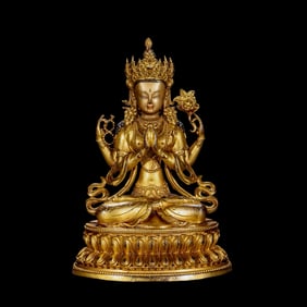A Chinese Qing Dynasty gilt bronze statue of a seated Buddha