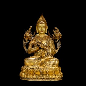 A Chinese Ming Dynasty gilt bronze statue of a seated Buddha