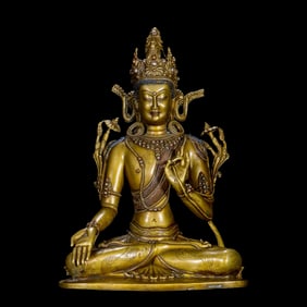 A Chinese Ming Dynasty gilt bronze statue of a seated Buddha