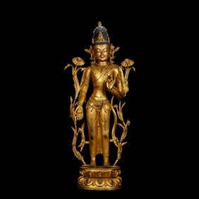 A Chinese Ming Dynasty gilt bronze standing Buddha statue