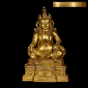 A Chinese Qing Dynasty gilt bronze statue of a seated Buddha