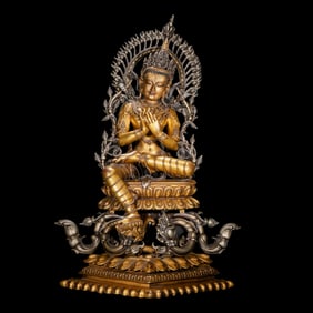 A Chinese Qing Dynasty gilt bronze statue of a seated Buddha
