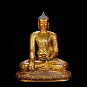 A Chinese gilt bronze statue of Sakyamuni Buddha from the Qianlong period of the Qing Dynasty