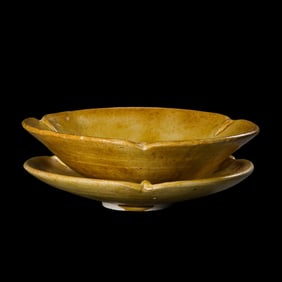 A set of yellow-glazed flower-mouthed saucers from the Tang Dynasty