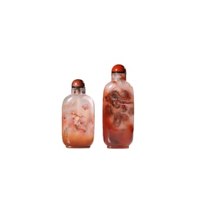 A pair of Chinese Qing Dynasty crystal snuff bottles with inside-painted dragon designs