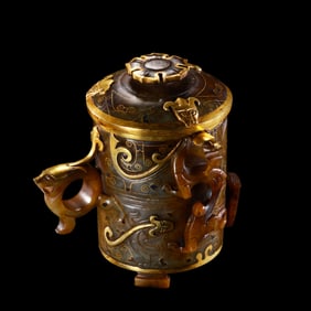 A gold-inlaid jade incense burner from the Warring States period of China