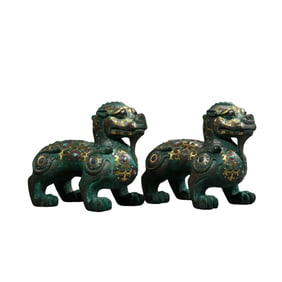 A pair of Chinese Warring States period auspicious beasts inlaid with gold and silver