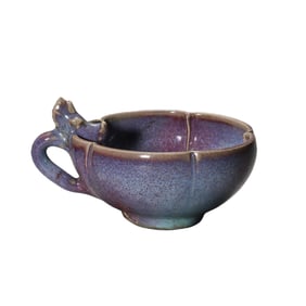 A Northern Song Dynasty Jun ware cup with sky-blue glaze and red floral handle.