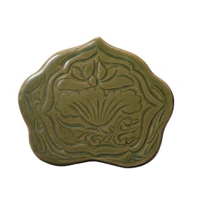 A celadon lotus-patterned pillow from the Yaozhou kiln of the Northern Song Dynasty, China.