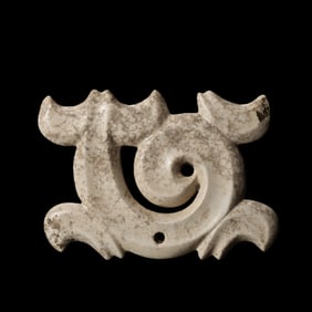 Chicken-bone white jade pendant from the Hongshan Culture of the Neolithic period in China.