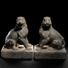 A pair of Chinese Tang Dynasty bluestone seated lion statues