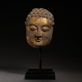 Gilded bluestone Buddha head from the Tang Dynasty in China