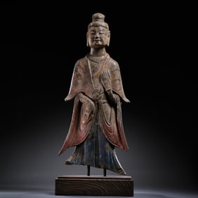 A standing Buddha statue painted on bluestone during the Northern Wei Dynasty in China