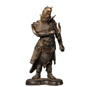 A gilt bronze standing statue of Guan Yu from the Ming Dynasty in China.
