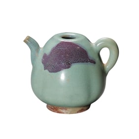 A Yuan Dynasty Jun ware sky-blue glazed melon-shaped ewer with red accents.