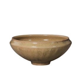 A rice-yellow glazed lotus petal-patterned bowl from the Longquan kiln of the Southern Song Dynasty,