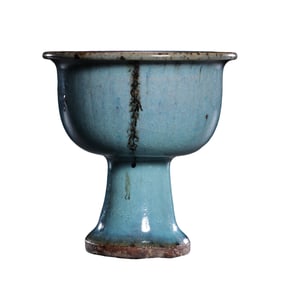 A three-legged censer with sky-blue glaze and red trim from the Jun kiln of the Jin Dynasty in China