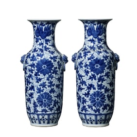 A pair of Qing Dynasty blue and white porcelain vases with lotus scroll design