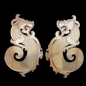 A pair of Chinese Han Dynasty jade pendants