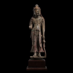 A standing Buddha statue painted on bluestone during the Northern Wei Dynasty in China