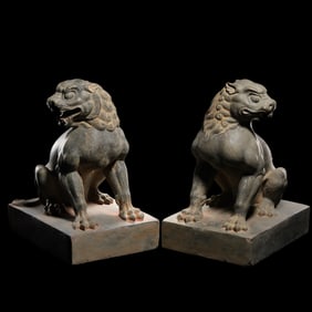A pair of Chinese Tang Dynasty bluestone seated lion statues
