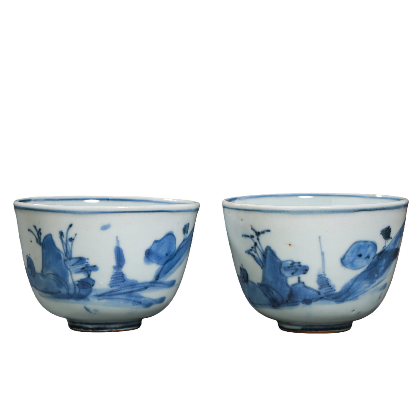 A pair of Qing Dynasty blue and white porcelain cups depicting landscapes and figures (1 of 7)