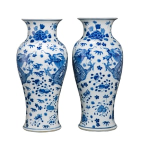 A pair of Chinese Qing Dynasty blue and white dragon-patterned vases