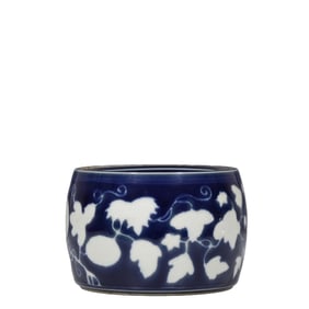 Ming Dynasty Xuande period blue-glazed cricket jar with white-glazed melon and fruit design