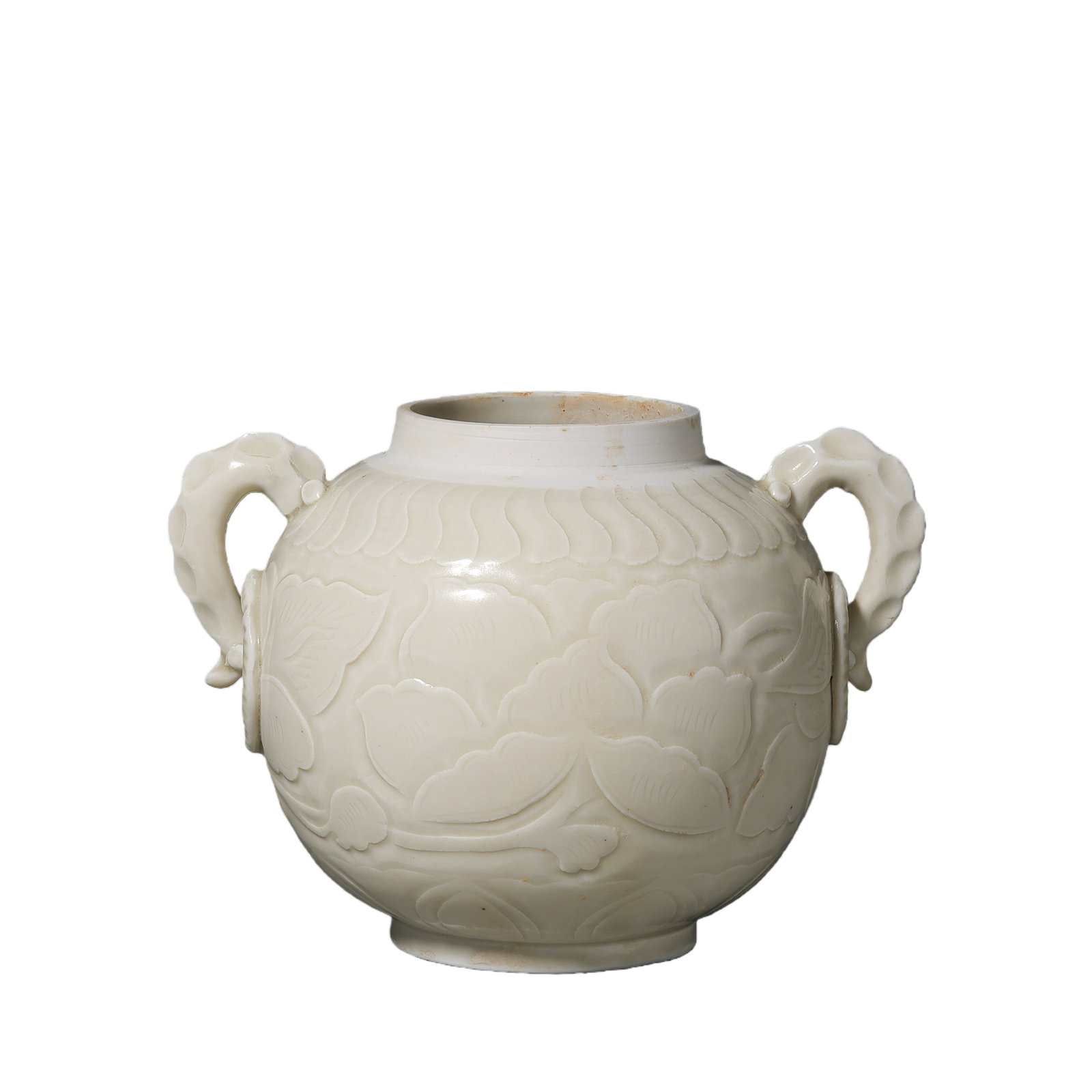 A white porcelain jar with floral design and the character "?" (official) mark from the Ding kiln: H. 12.5 cm. W. 17.5 cm.