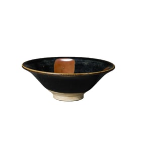 A Northern Song Dynasty Cizhou ware conical bowl with iron rust decoration.