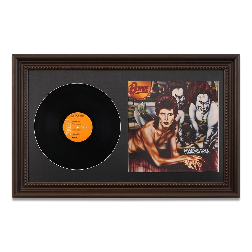 DAVID BOWIE SIGNED "DIAMOND DOGS" FRAMED LP DISPLAY: Framed Dimensions: 19 1/2 x 30 3/4 in (49.5 x 78 cm) Provenance and Authentication: This collectible has undergone a rigorous forensic evaluation. The signatures were carefully analyzed across