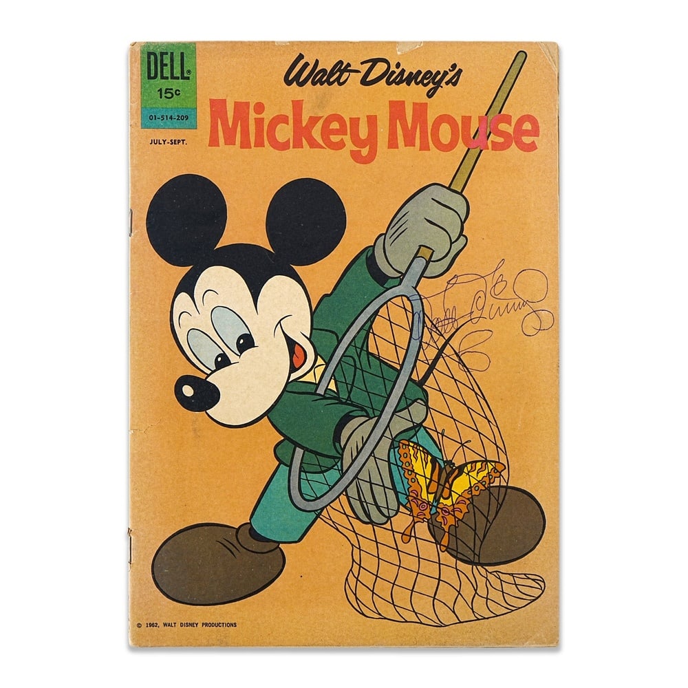 WALT DISNEY SIGNED "WALT DISNEY'S MICKEY MOUSE" (JULY-SEPTEMBER 1962): 10 1/4 x 7 1/4 in (26 x 18.5 cm) A signed copy of Walt Disney's Mickey Mouse, published by Dell Publishing for the July-September 1962 issue, featuring Mickey Mouse with a butterfly net on the front