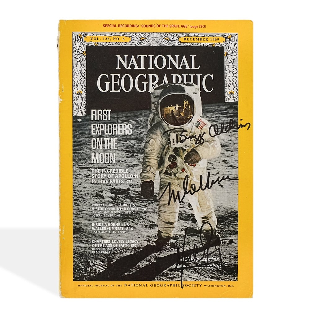 APOLLO 11 CREW FULLY SIGNED NATIONAL GEOGRAPHIC MAGAZINE (DECEMBER 1969): 10 x 6 7/8 in (25.5 x 17.5 cm) Provenance and Authentication: According to the accompanying documentation provided by the consignor, the signatures have been examined with reference to multiple factor