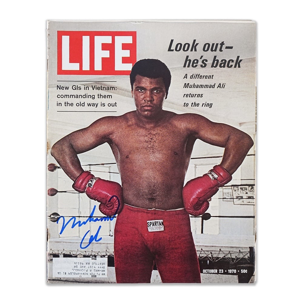 MUHAMMAD ALI SIGNED LIFE MAGAZINE (OCTOBER 23, 1970): 13 3/8 x 10 1/2 in (34 x 26.7 cm) Provenance and Authentication: According to the accompanying documentation provided by the consignor, the signatures have been examined with reference to multiple