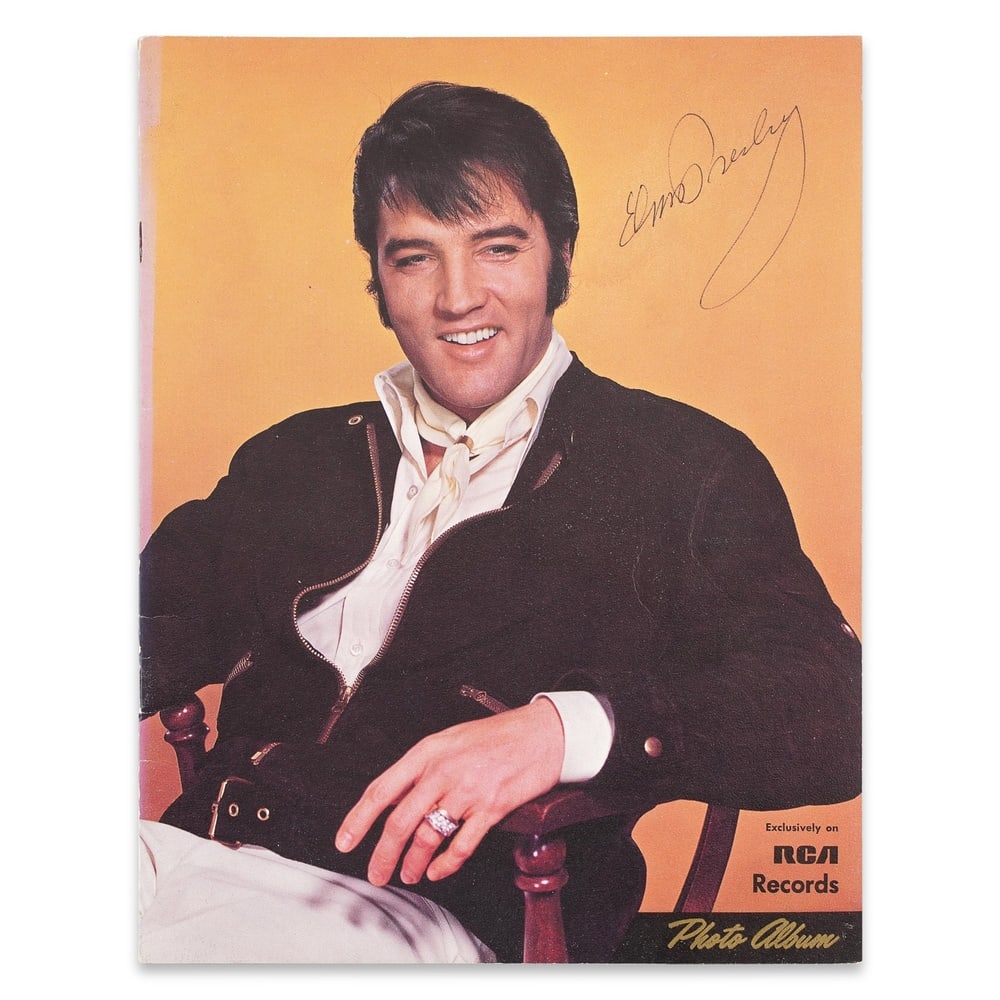 ELVIS PRESLEY SIGNED RCA RECORDS SOUVENIR PHOTO ALBUM: 11 x 8 1/2 in (28 x 21.5 cm) Provenance and Authentication: This collectible has undergone a rigorous forensic evaluation. The signatures were carefully analyzed across multiple criteria, including