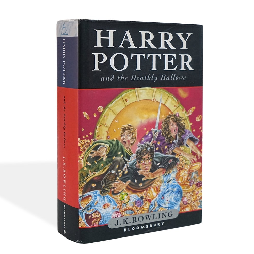 J. K. ROWLING SIGNED HARRY POTTER AND THE DEATHLY HALLOWS FIRST EDITION: 9 1/4 x 6 1/4 in (23.5 x 16 cm) Harry Potter and the Deathly Hallows is the seventh and concluding novel in J. K. Rowling's internationally celebrated Harry Potter series, bringing one of the most