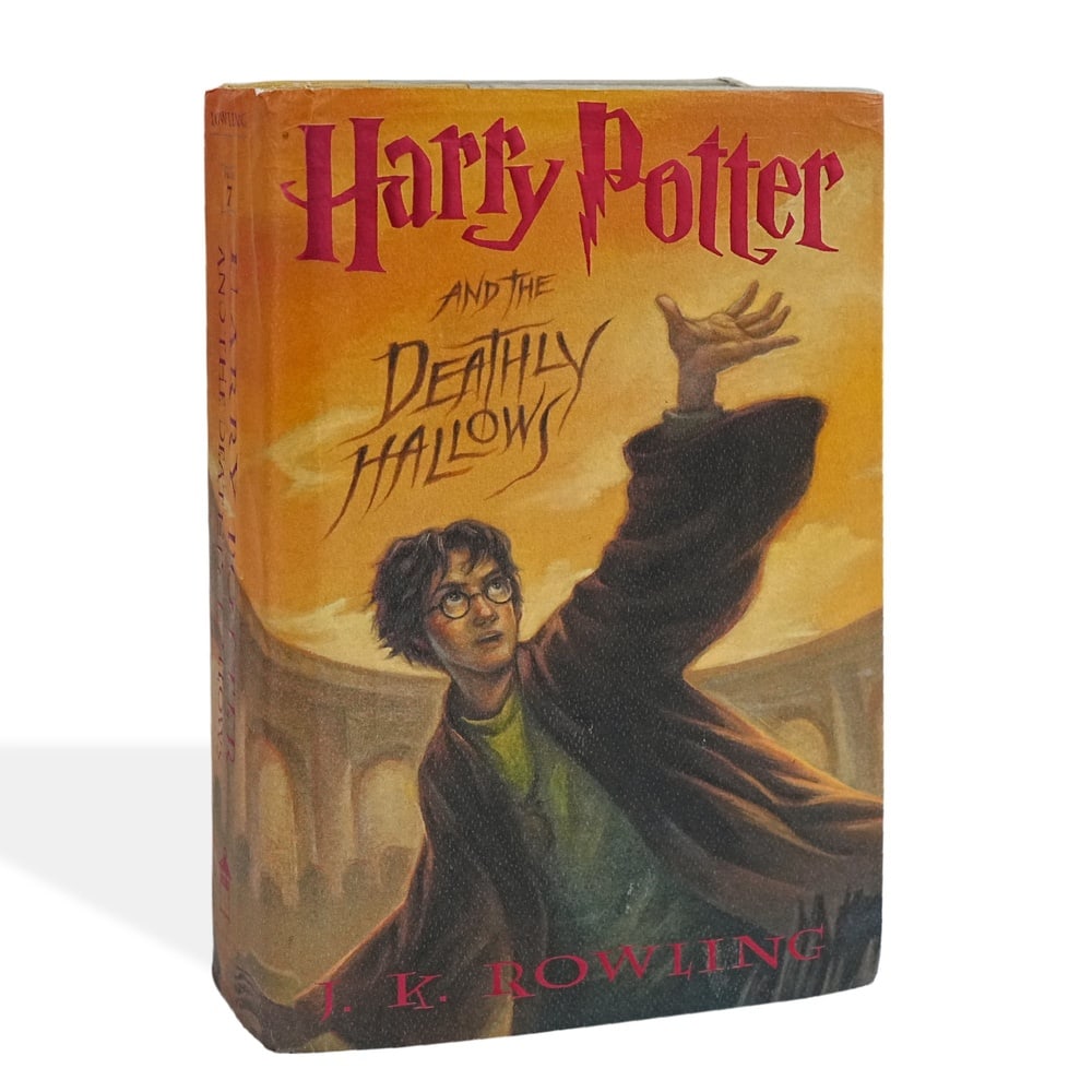 J. K. ROWLING SIGNED HARRY POTTER AND THE DEATHLY HALLOWS FIRST EDITION FIRST PRINTING: 9 1/4 x 6 1/4 in (23.5 x 16 cm) Harry Potter and the Deathly Hallows is the seventh and final novel in J. K. Rowling's legendary Harry Potter series, concluding one of the most influential literary