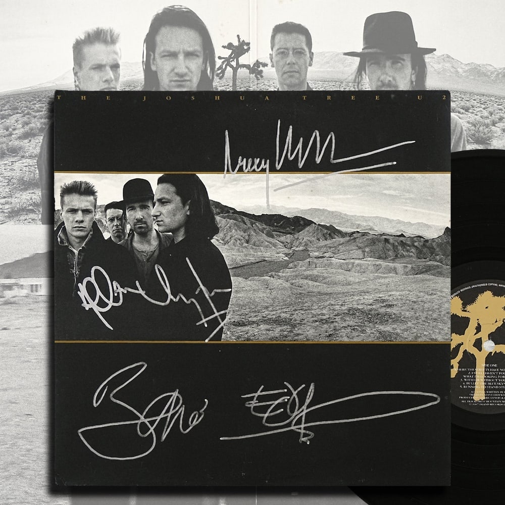 U2 FULLY SIGNED "THE JOSHUA TREE" U.K. FIRST PRESSING: 12 1/4 x 12 1/4 in Provenance and Authentication: According to the accompanying documentation provided by the consignor, the signatures have been examined with reference to multiple factors,