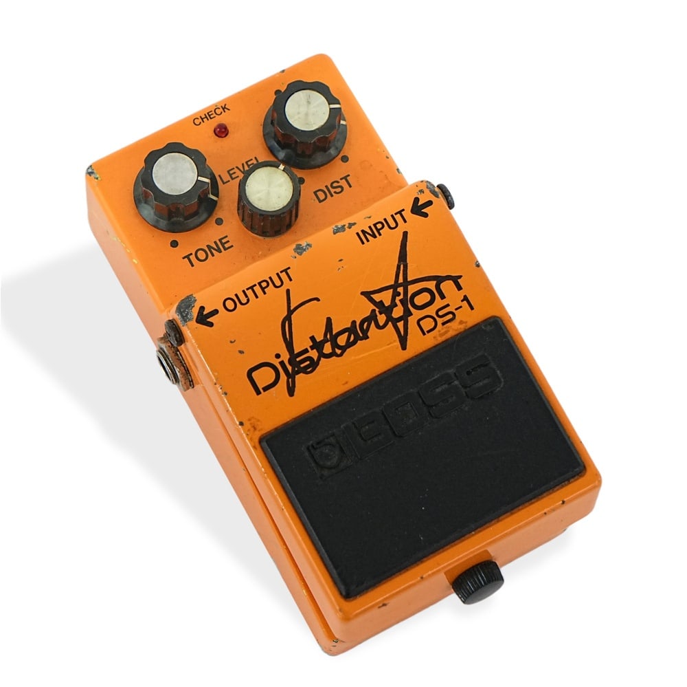 KURT COBAIN SIGNED BOSS DS-1 DISTORTION PEDAL (1980S JAPAN): 4 3/4 x 2 1/2 x 2 in (12 x 6.2 x 5 cm) Provenance and Authentication: According to the accompanying documentation provided by the consignor, the signatures have been examined with reference to