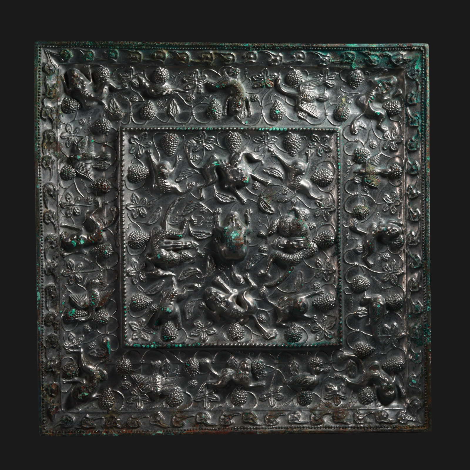 Square bronze mirror with sea beast and grape design from the Tang Dynasty, China: W. 32.5 cm. Weight 8670 grams.