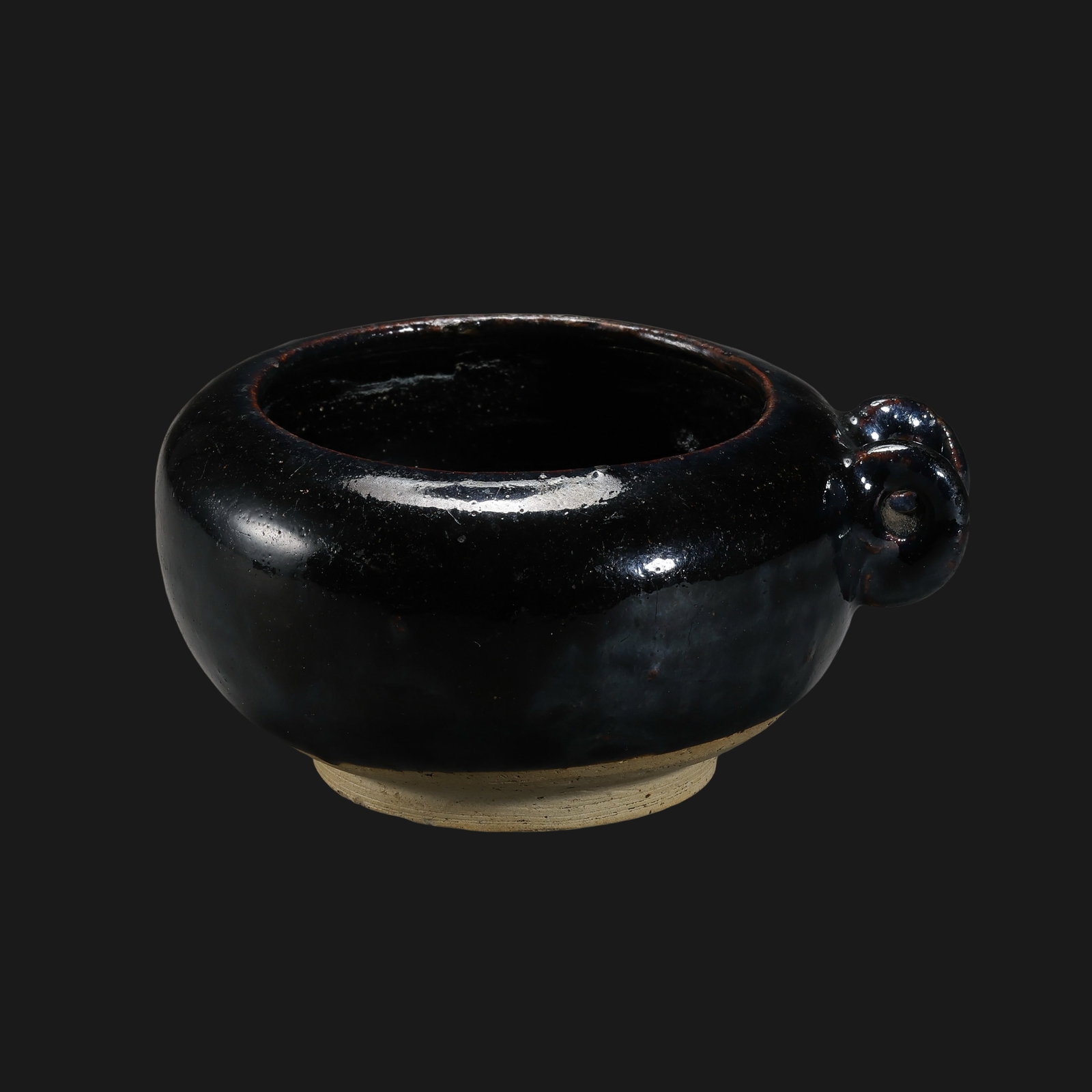 Cizhou ware black-glazed water dropper from the Northern Song Dynasty in China: H. 5.5 cm. W. 11 cm.