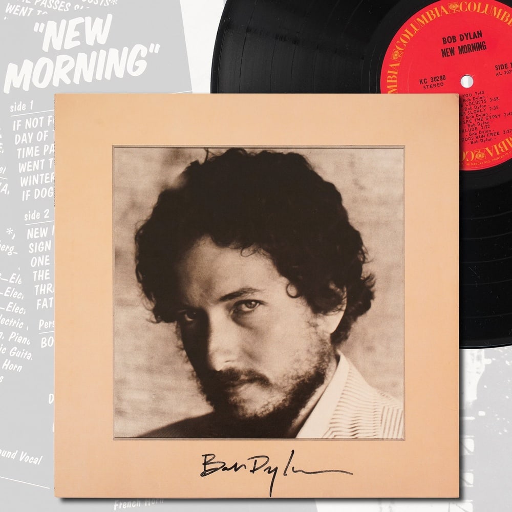 BOB DYLAN SIGNED "NEW MORNING" LP: 12 1/4 x 12 1/4 in Provenance and Authentication: According to the Letter of Authenticity (LOA) and Certificate of Authenticity (COA) provided by the consignor, this collectible was subjected to a for