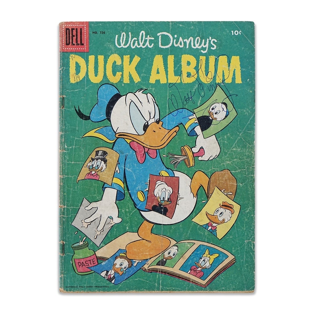 WALT DISNEY SIGNED "WALT DISNEY'S DUCK ALBUM" NO. 726 (1956): 10 1/4 x 7 1/4 in (26 x 18.5 cm) Provenance and Authentication: According to the accompanying documentation provided by the consignor, the signatures have been examined with reference to multiple fact