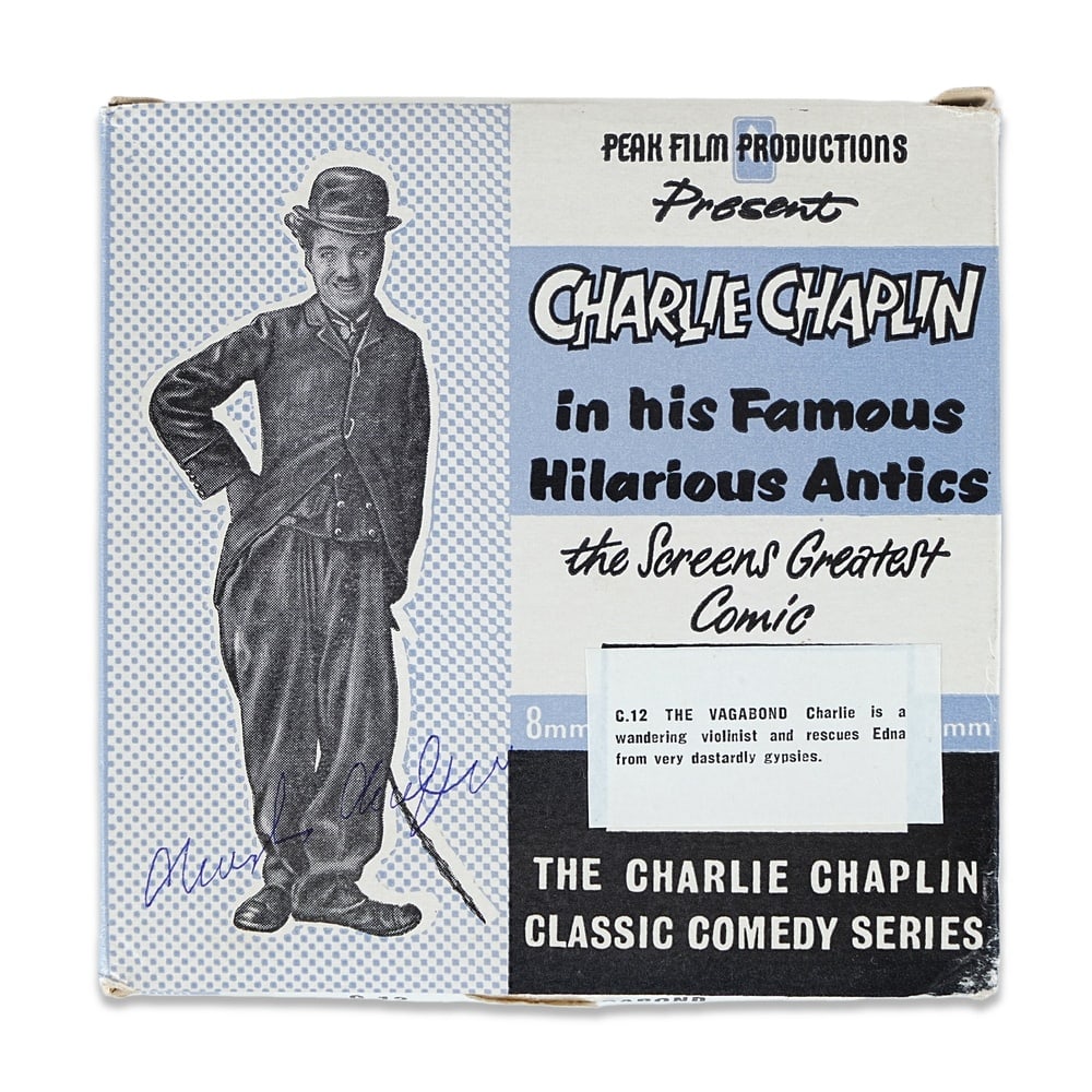 CHARLIE CHAPLIN SIGNED "THE VAGABOND" 8MM FILM REEL: Diameter 4 3/8 in (11 cm) Provenance and Authentication: According to the accompanying documentation provided by the consignor, the signatures have been examined with reference to multiple factors,