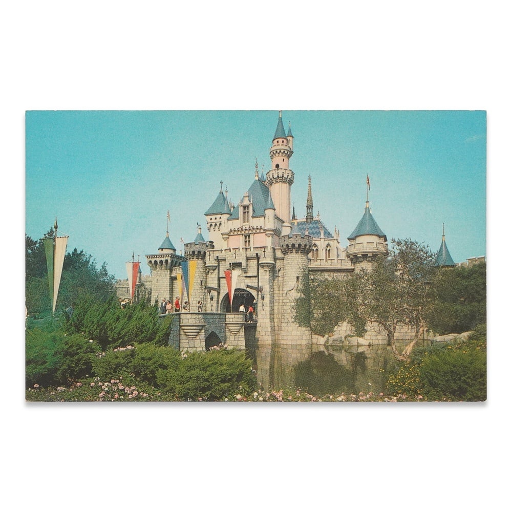 WALT DISNEY SIGNED DISNEYLAND SLEEPING BEAUTY CASTLE POSTCARD: 5 1/2 x 3 1/2 in (14 x 8.9 cm) Provenance and Authentication: According to the Letter of Authenticity (LOA) and Certificate of Authenticity (COA) provided by the consignor, this collectible was