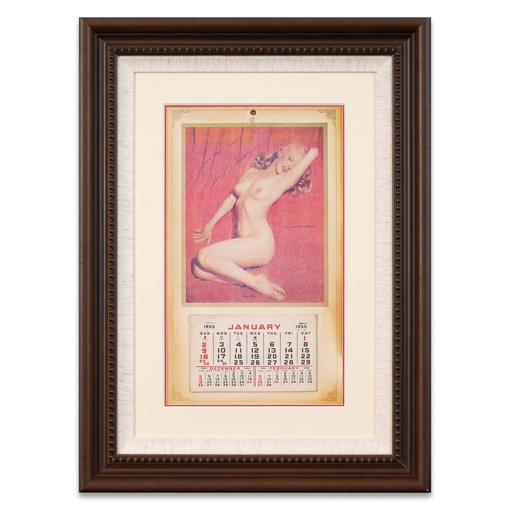 MARILYN MONROE SIGNED "GOLDEN DREAMS" CALENDAR: Dimensions: 16 3/8 x 9 5/8 in (41.7 x 24.4 cm) Framed Dimensions: 26 3/8 x 19 1/2 in (67 x 49.5 cm) Provenance and Authentication: According to the Letter of Authenticity (LOA) and Certificate of Auth