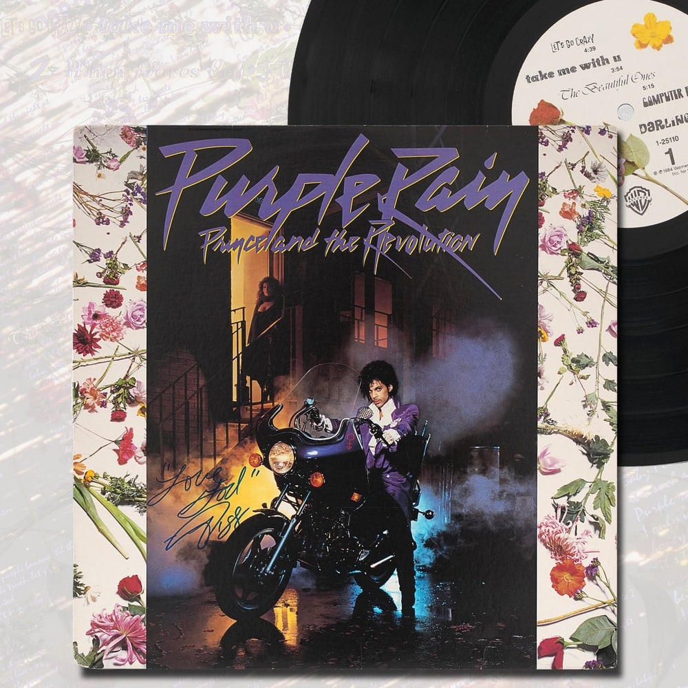 PRINCE SIGNED "PURPLE RAIN" LP: 12 3/8 x 12 3/8 in (31.5 x 31.5 cm) Provenance and Authentication: According to the Letter of Authenticity (LOA) and Certificate of Authenticity (COA) provided by the consignor, this collectible was s