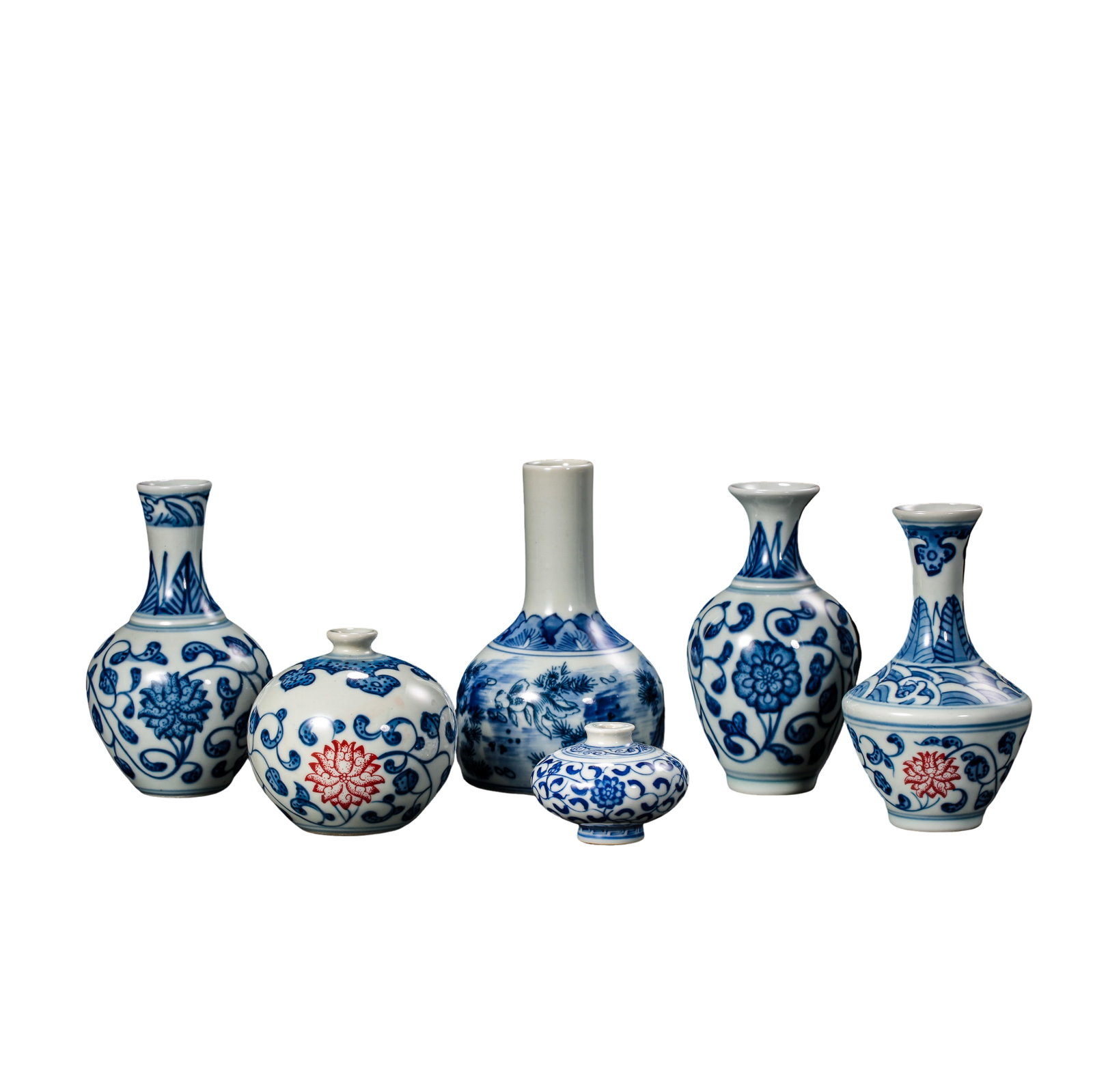 Qing Dynasty (18th Century) A Group of Seven Blue and Underglaze Red Scholar’s Desk Miniature: Dimensions: Each piece approximately 12 cm / 4.7 in in height; overall display size varies by arrangement; Qing Dynasty, 18th Century?Condition & Provenance: Overall in good condition with expected