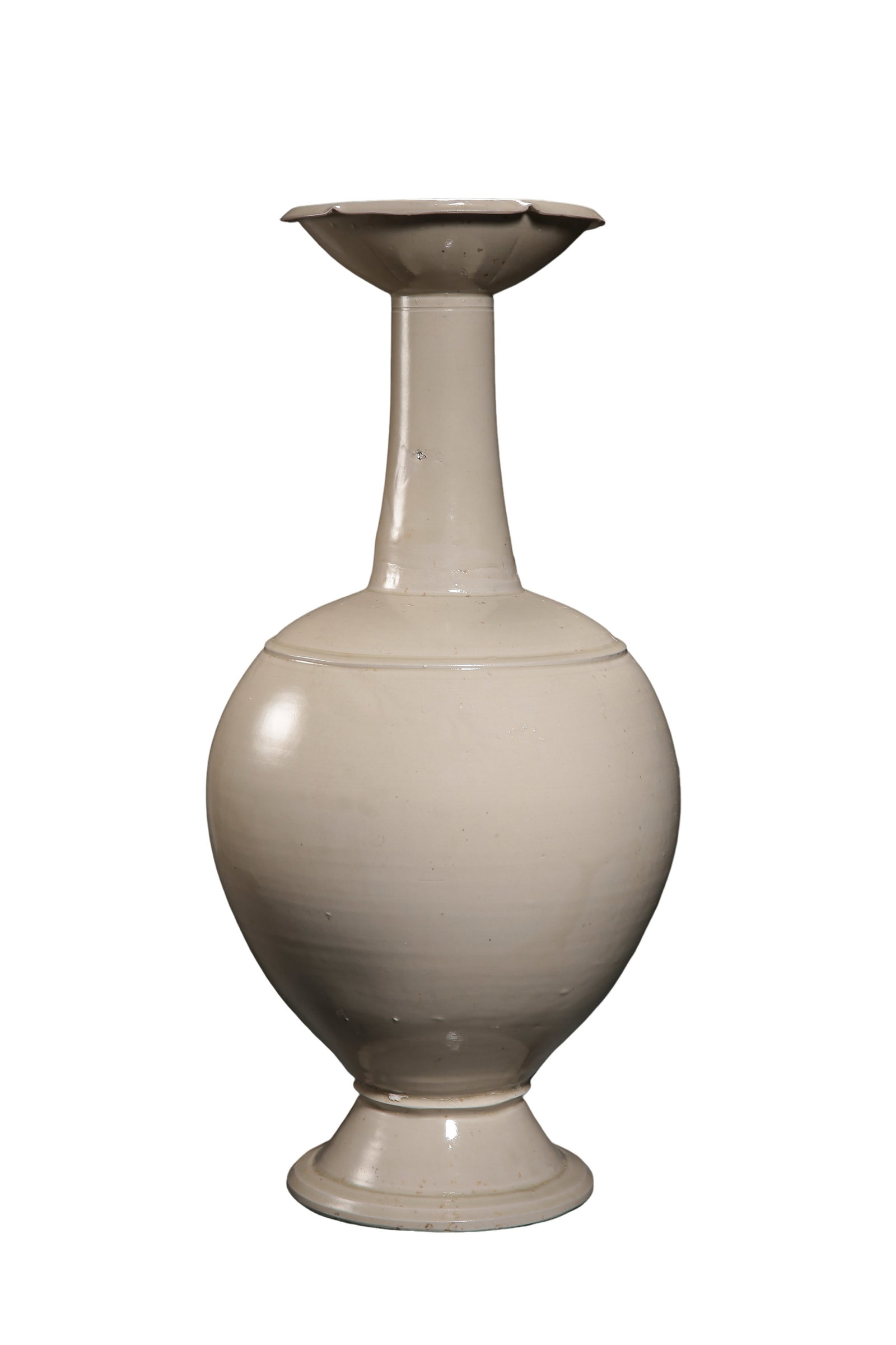 Liao?Ding?Ware White?Glazed Flower?Mouthed Long?Neck Vase: Dimensions:Mouth diameter 15cm(5.91in),Overall height 47cm(18.50in),10th?12th Century?Condition & Provenance:This monumental Liao?Ding?ware white?glazed vase is largely intact and retains its original